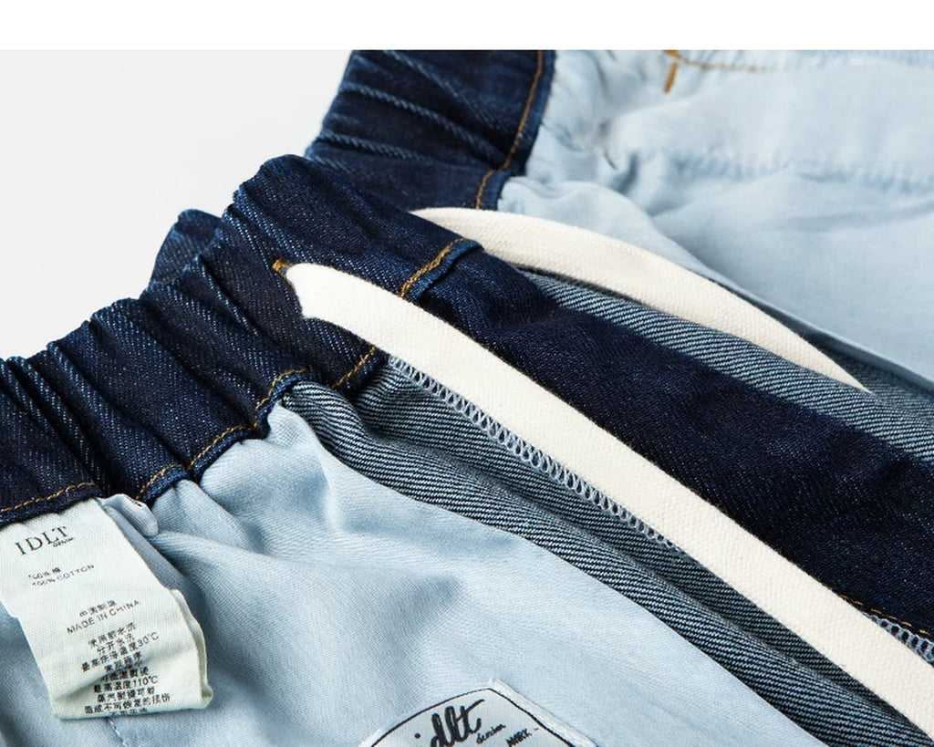IDLT drawstring jeans, dark blue inner waistband stitching.