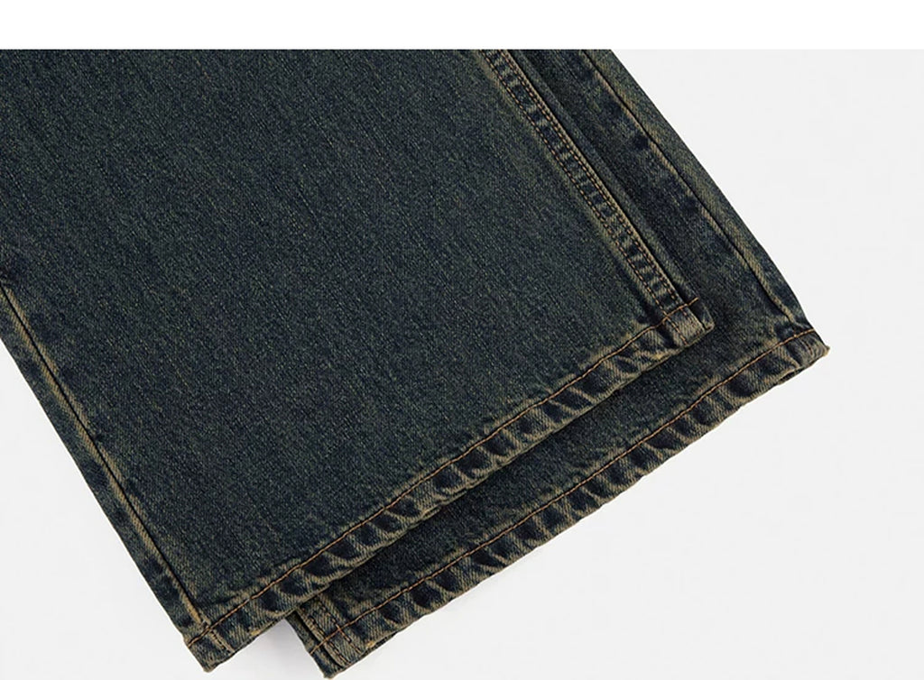 IDLT jeans, dark washed leg hems.