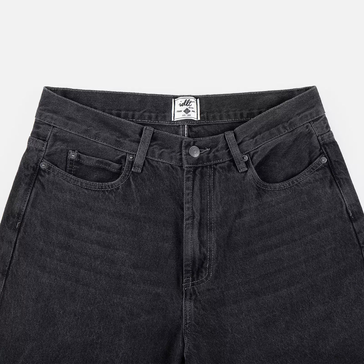 IDLT jeans, washed black waistband overview.
