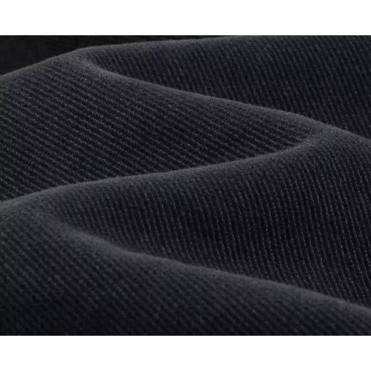 IDLT jeans, washed black denim texture.