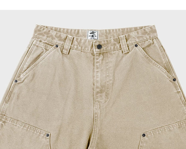 IDLT carpenter pants, beige waistband and pockets.
