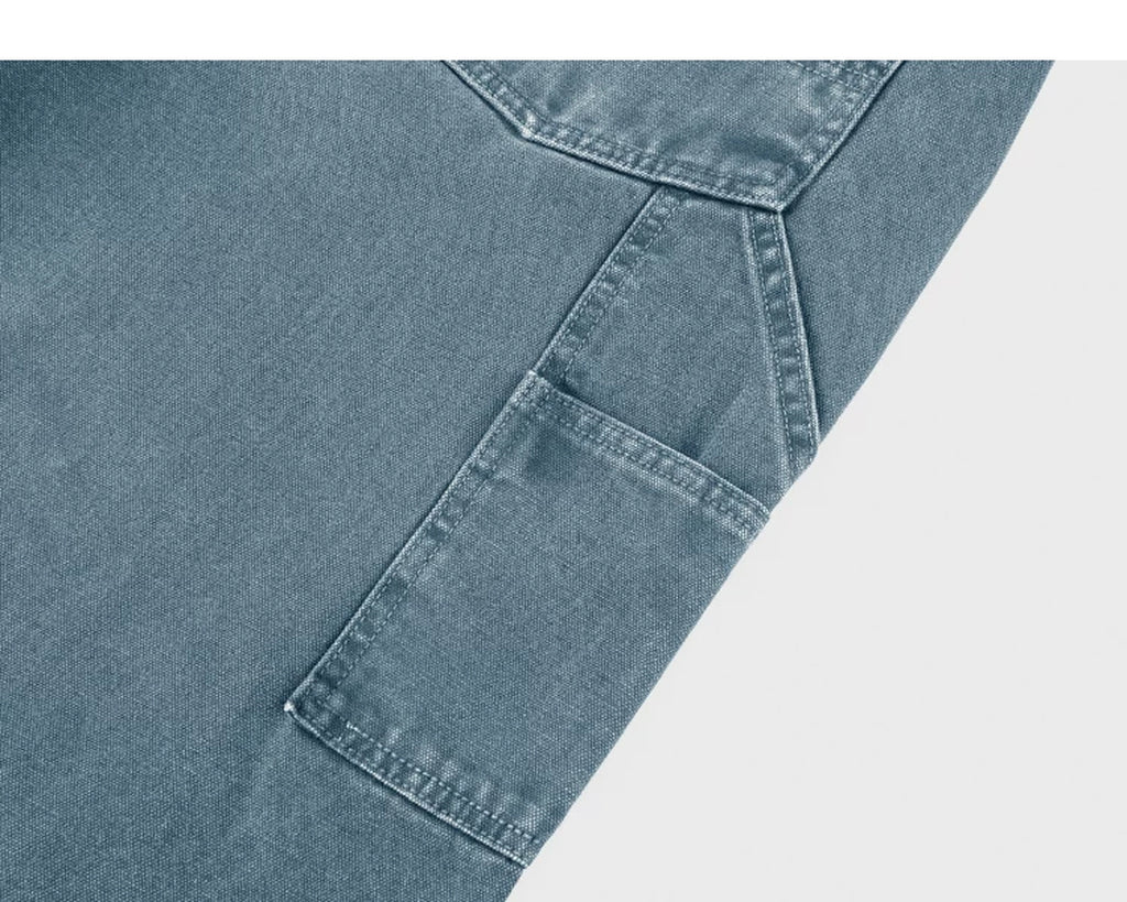 IDLT carpenter pants, blue utility pocket.