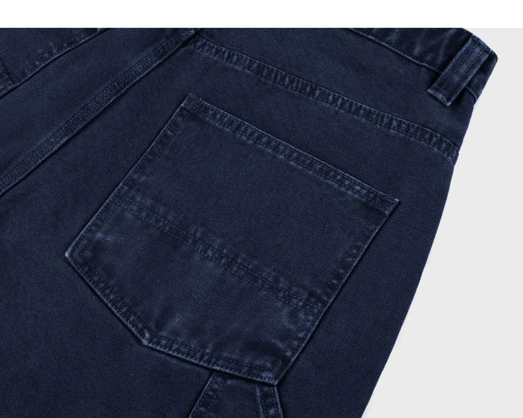 IDLT carpenter pants, dark blue back pocket.