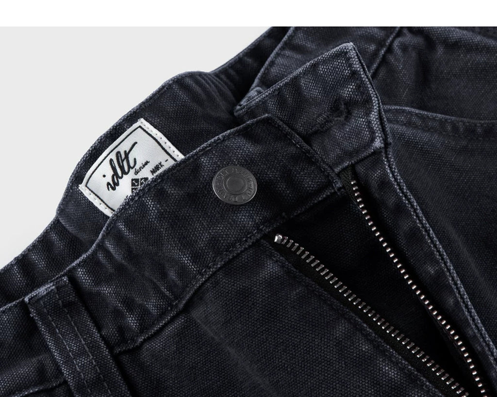 IDLT carpenter pants, black waist button and label.