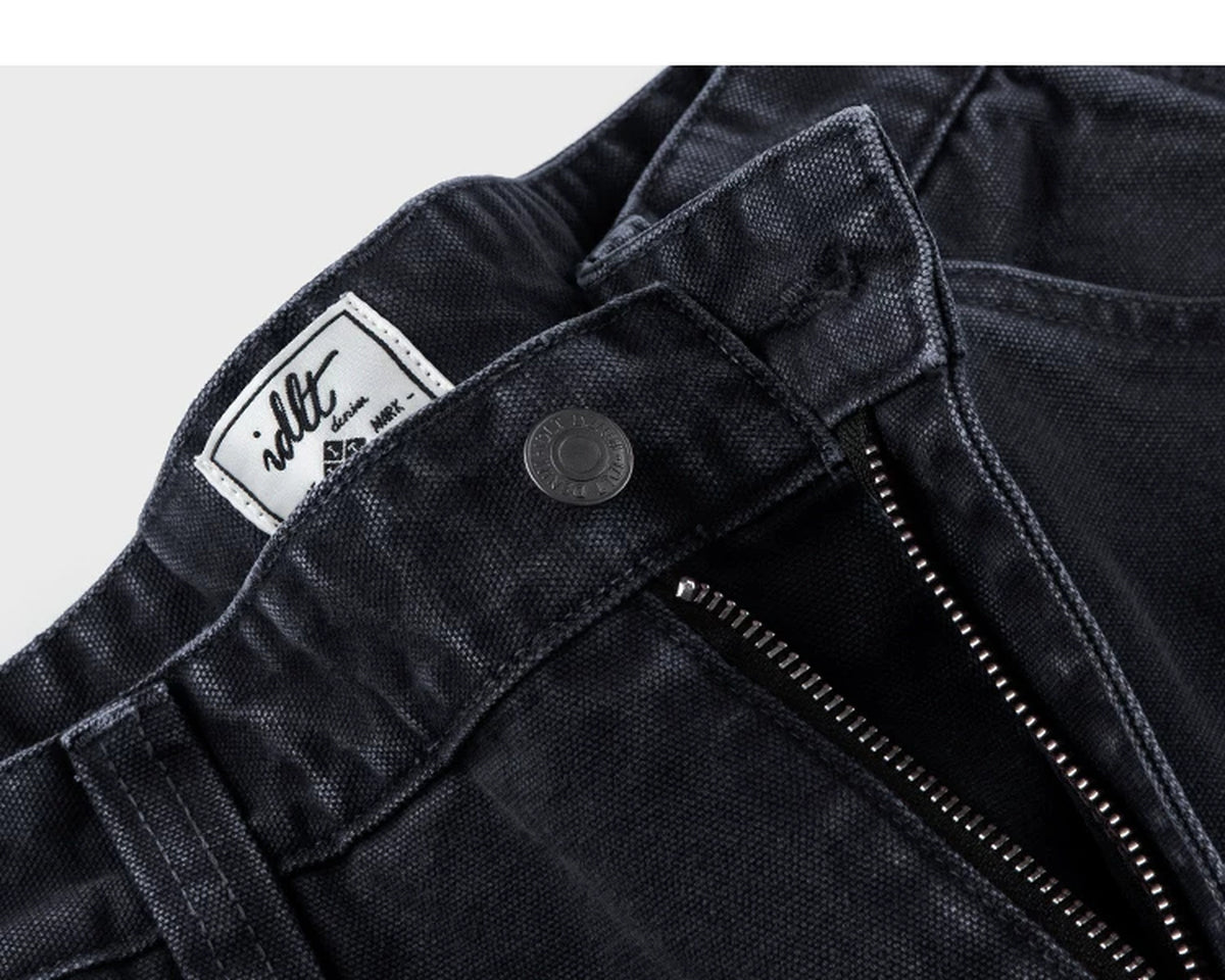 IDLT carpenter pants, black waist button and label.