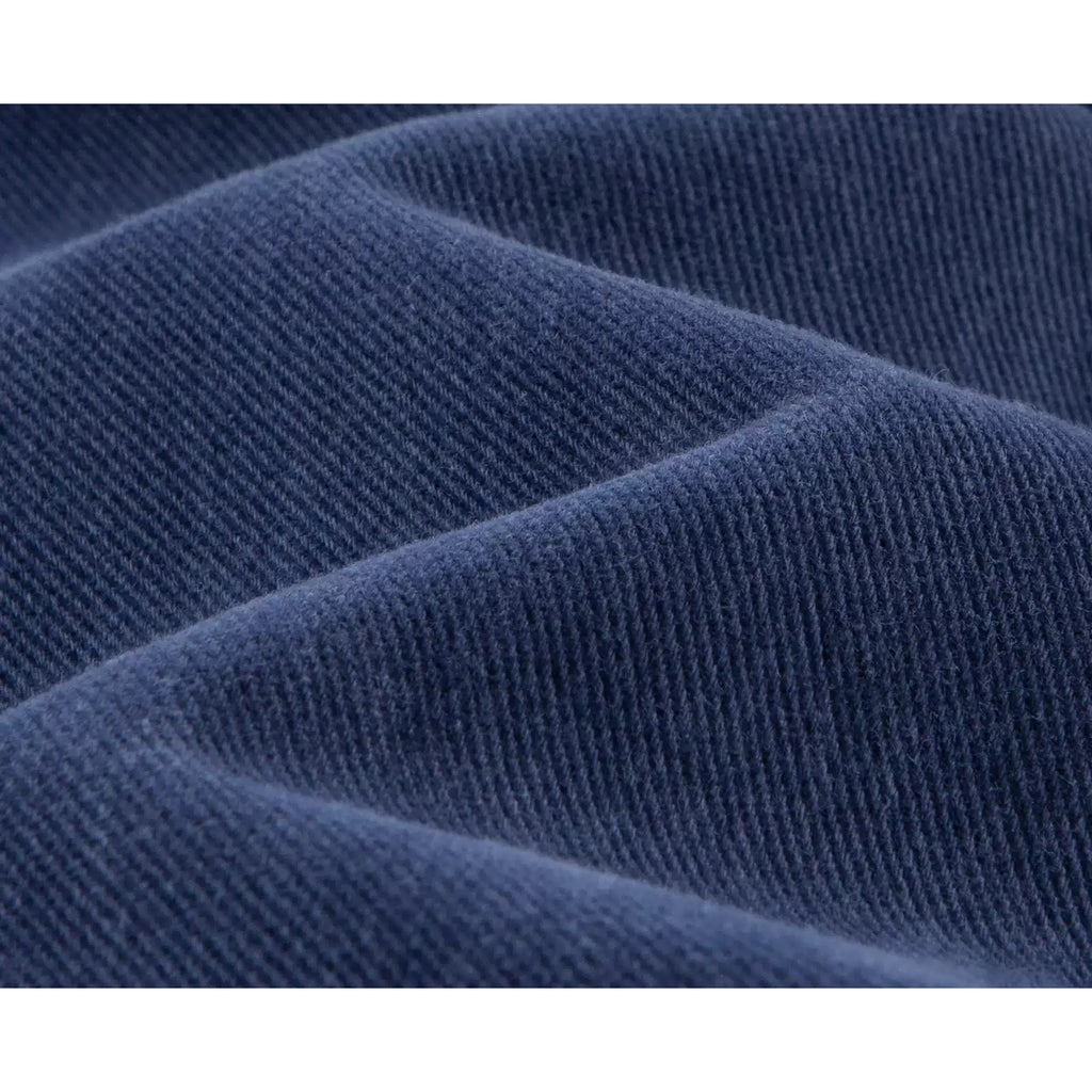 IDLT jeans, blue denim texture.