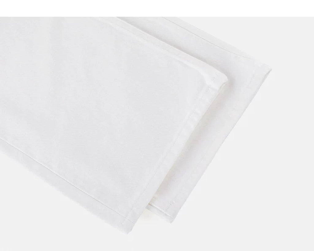 IDLT jeans, white leg hems.