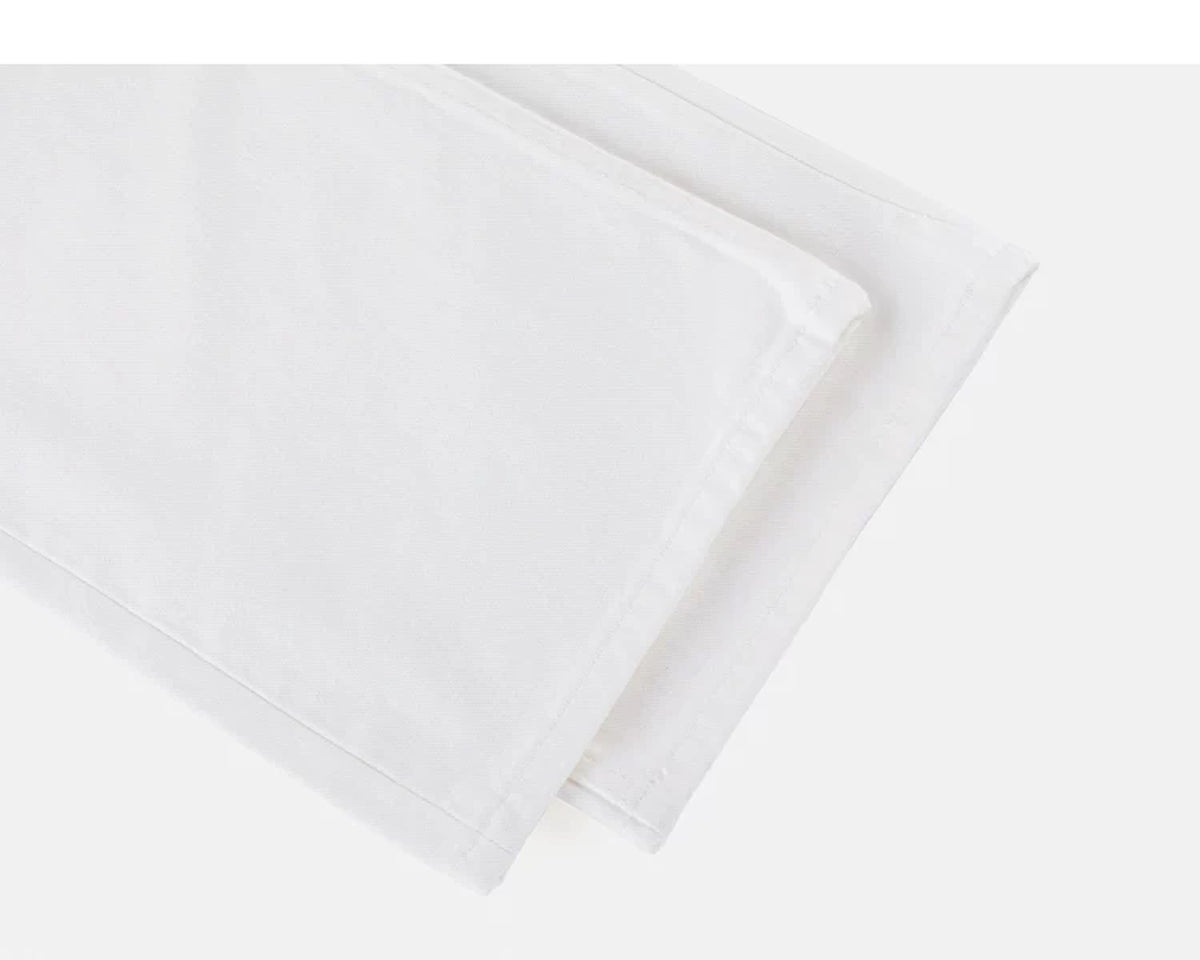IDLT jeans, white leg hems.