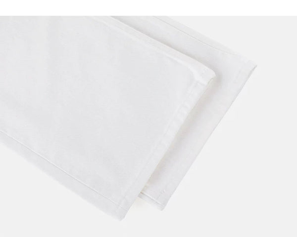 IDLT jeans, white leg hems.