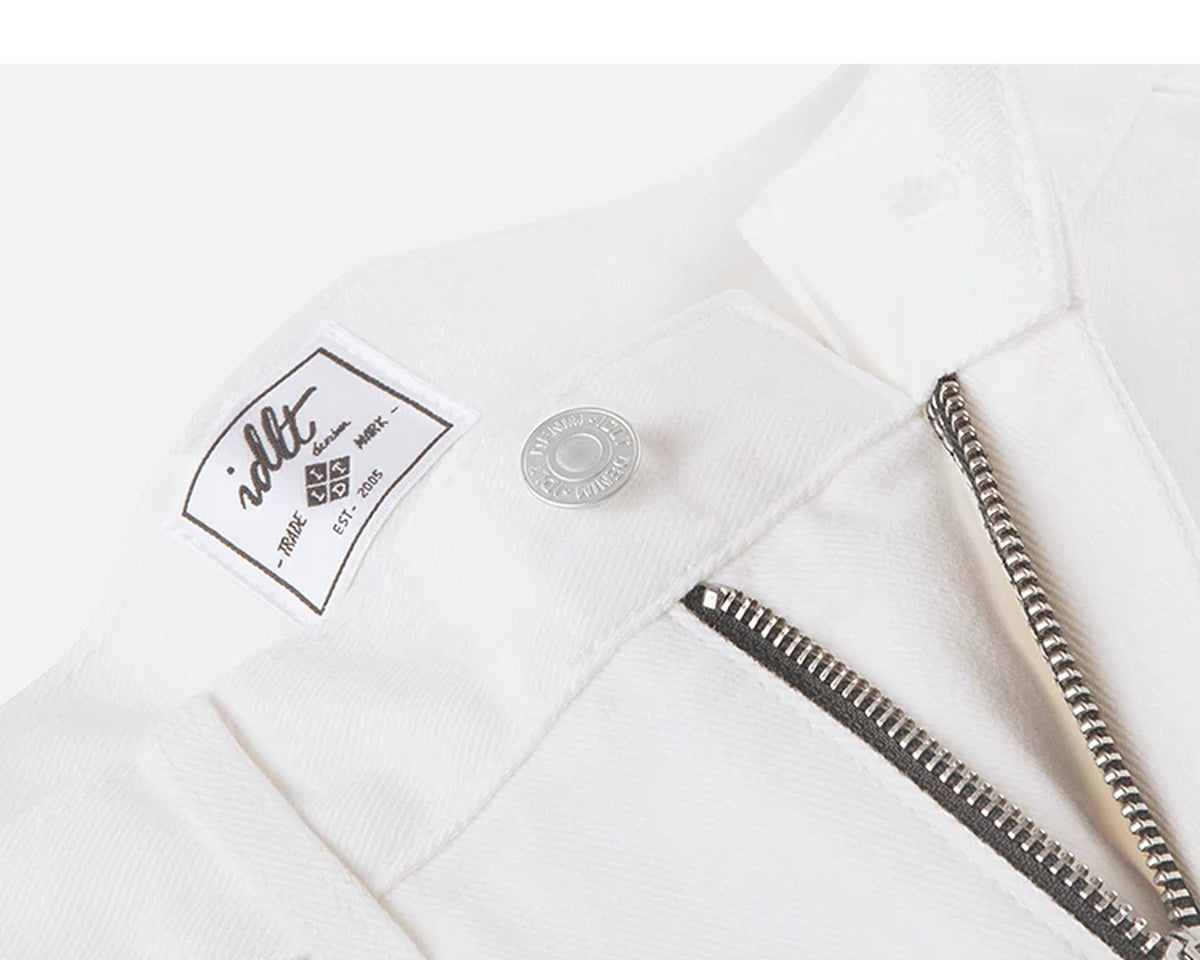 IDLT jeans, white waist button and label.