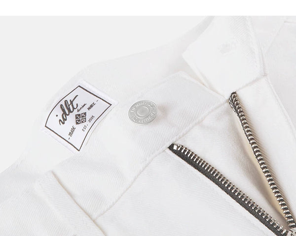 IDLT jeans, white waist button and label.