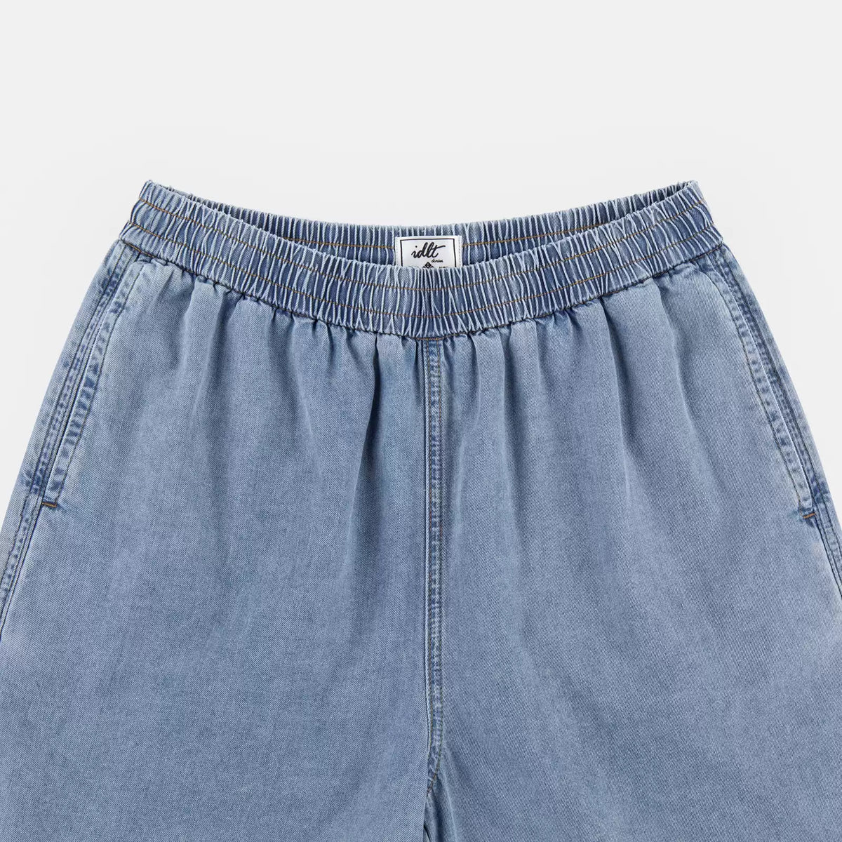 IDLT denim shorts, light blue waistband overview.