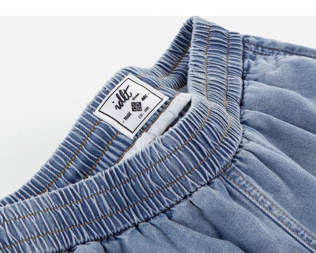IDLT denim shorts, light blue waistband label.
