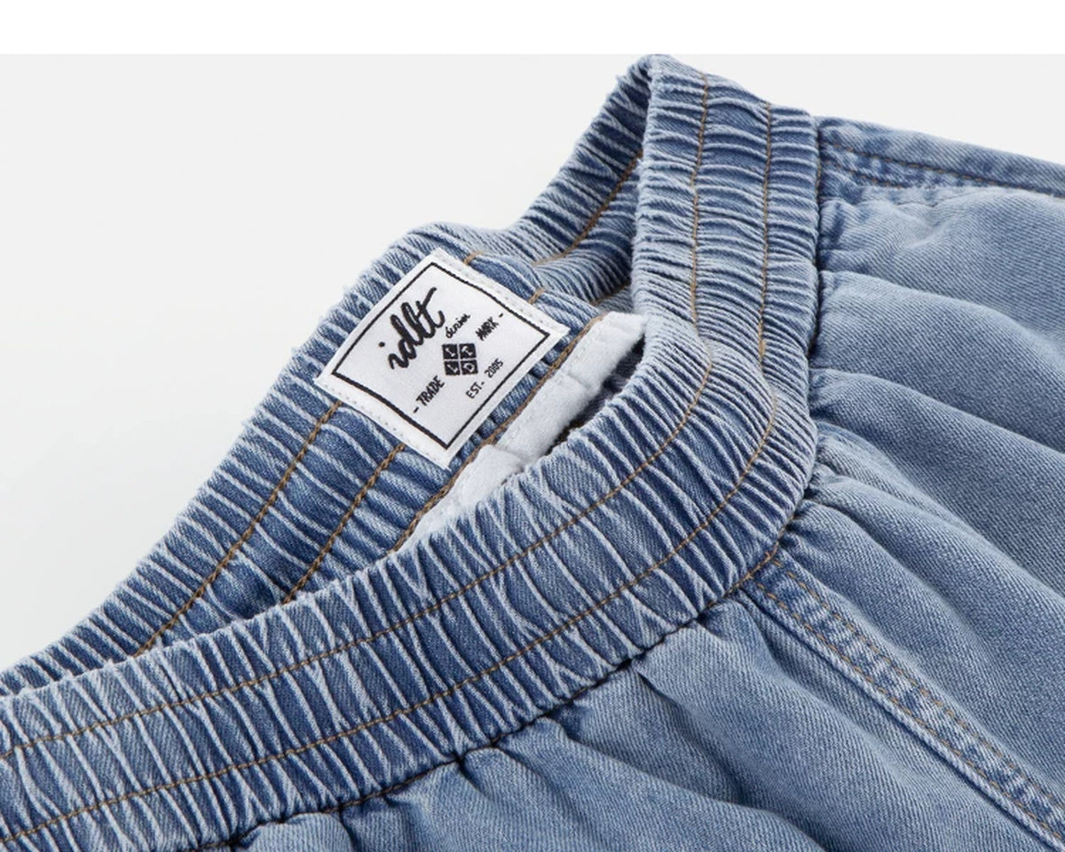 IDLT denim shorts, light blue waistband label.