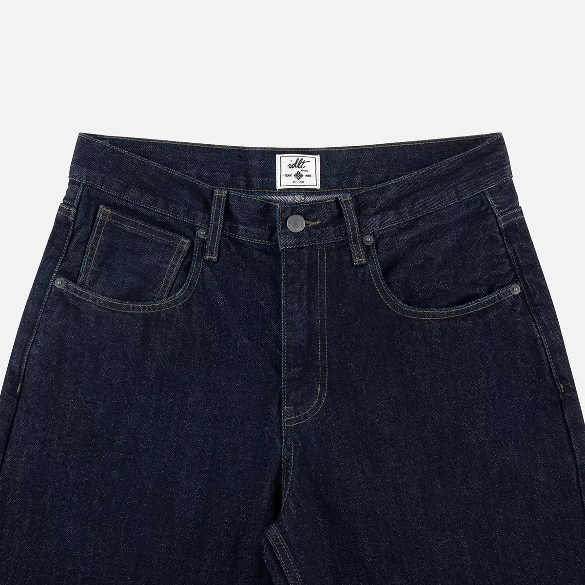 IDLT jeans, dark blue waistband overview.