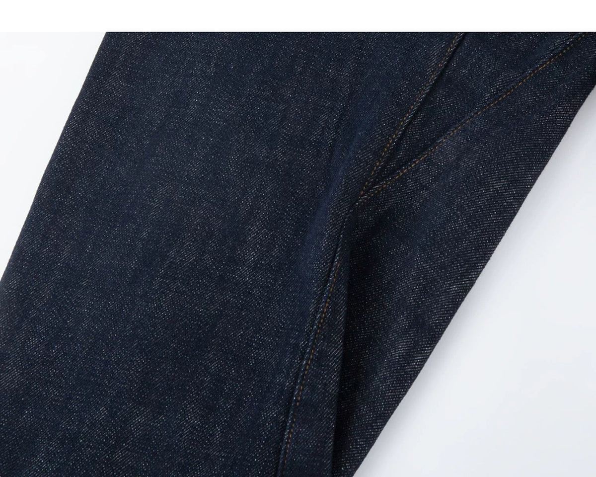 IDLT jeans, dark blue curved leg seam.