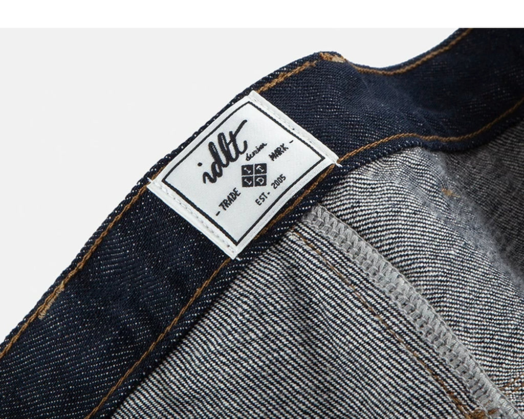 IDLT jeans, dark blue inner label.