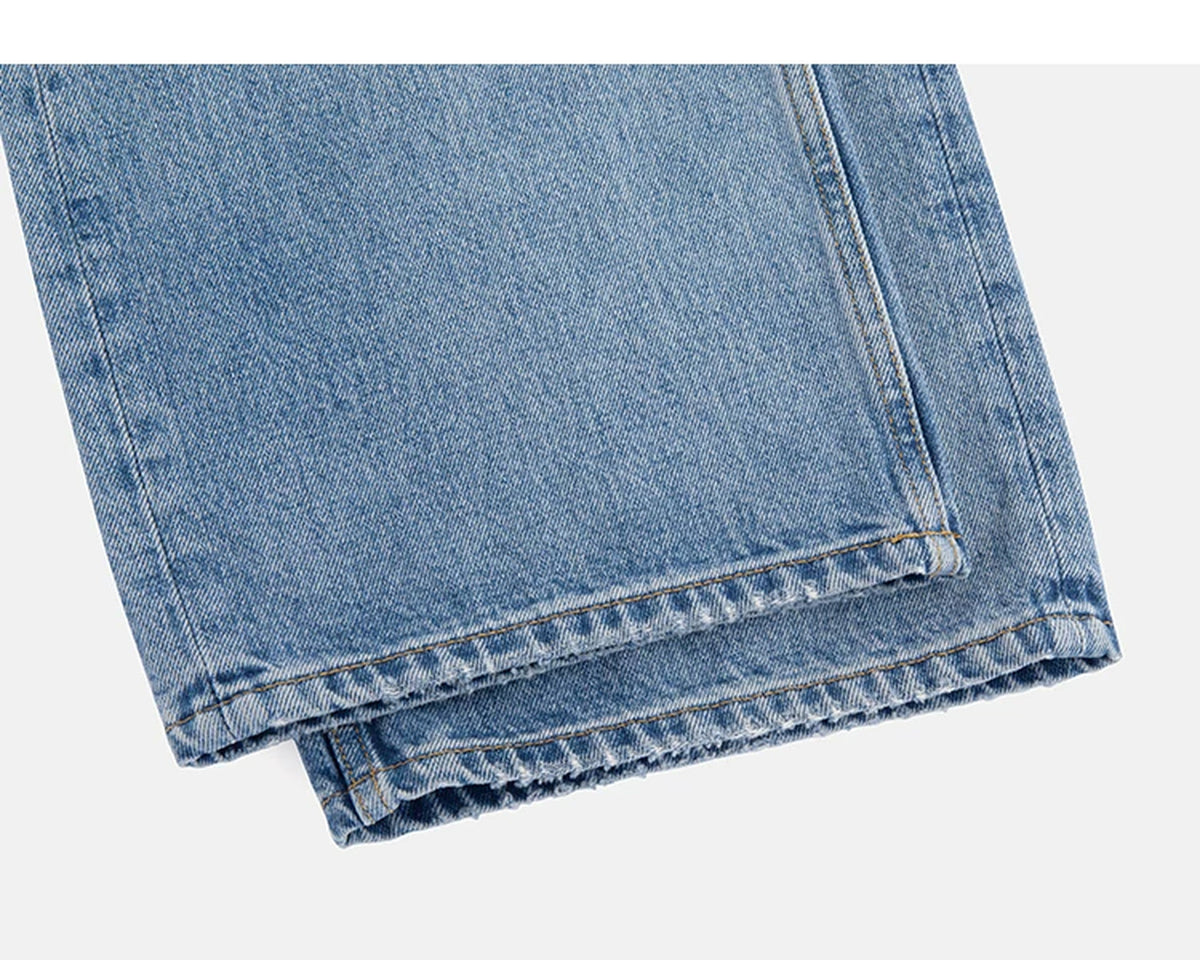 IDLT jeans, washed blue leg hems.