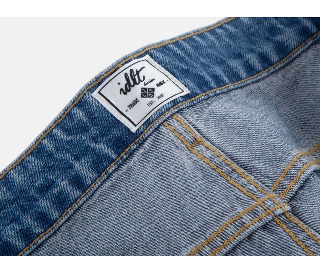 IDLT jeans, washed blue inner label.