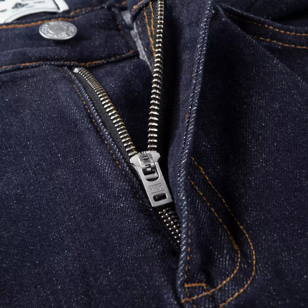 IDLT jeans, dark blue zipper close-up.