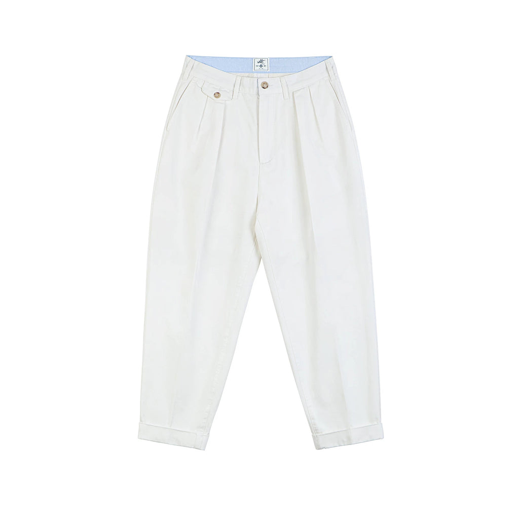 IDLT pleated trousers, white front.