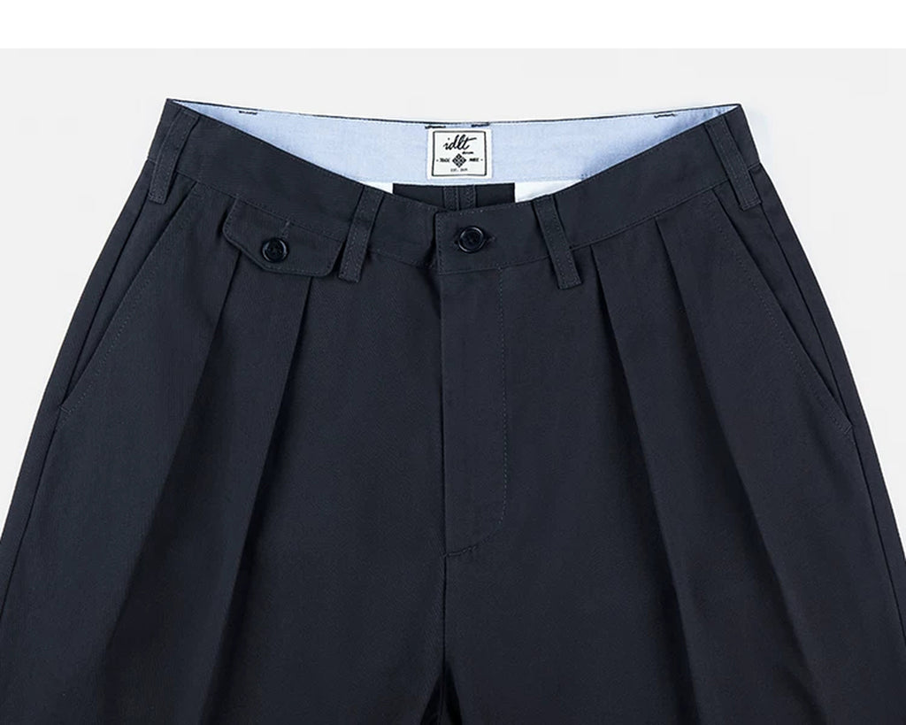 IDLT pleated trousers, navy waistband and pleats.