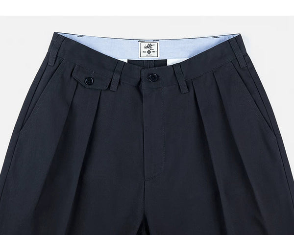 IDLT pleated trousers, navy waistband and pleats.