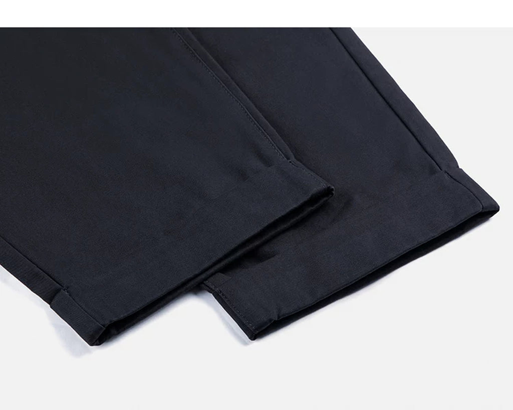 IDLT pleated trousers, navy leg hems.