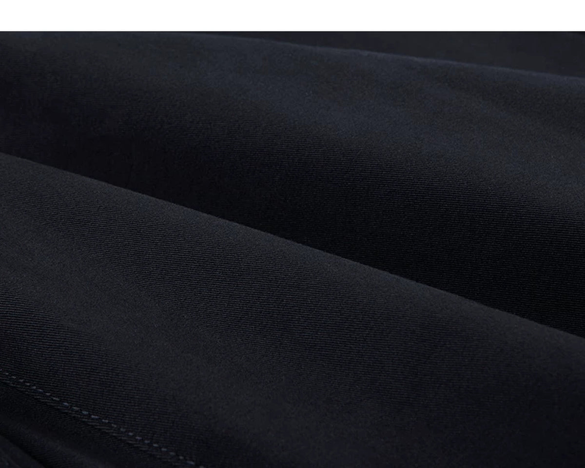 IDLT pleated trousers, navy fabric folds.