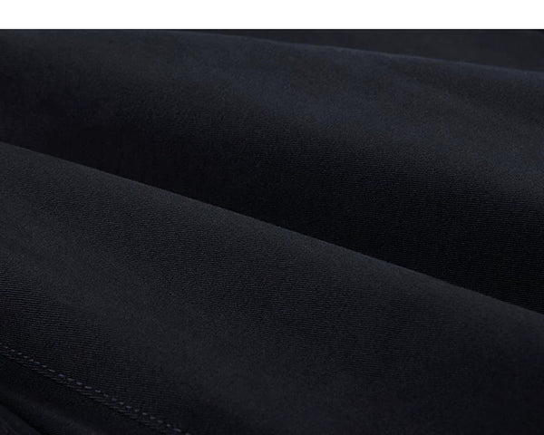 IDLT pleated trousers, navy fabric folds.