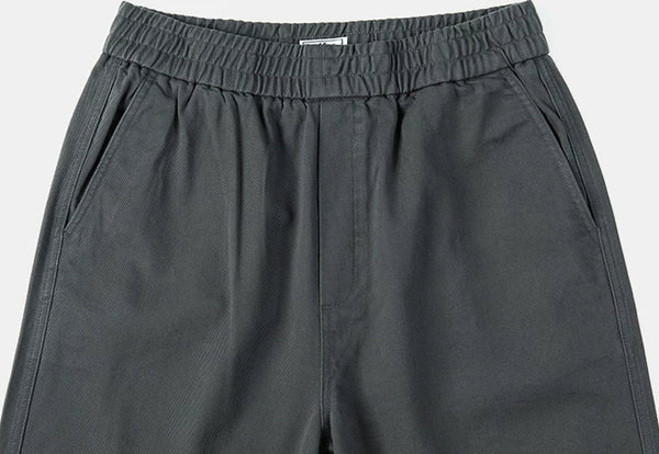 IDLT elastic waist trousers, dark gray waistband and pockets.