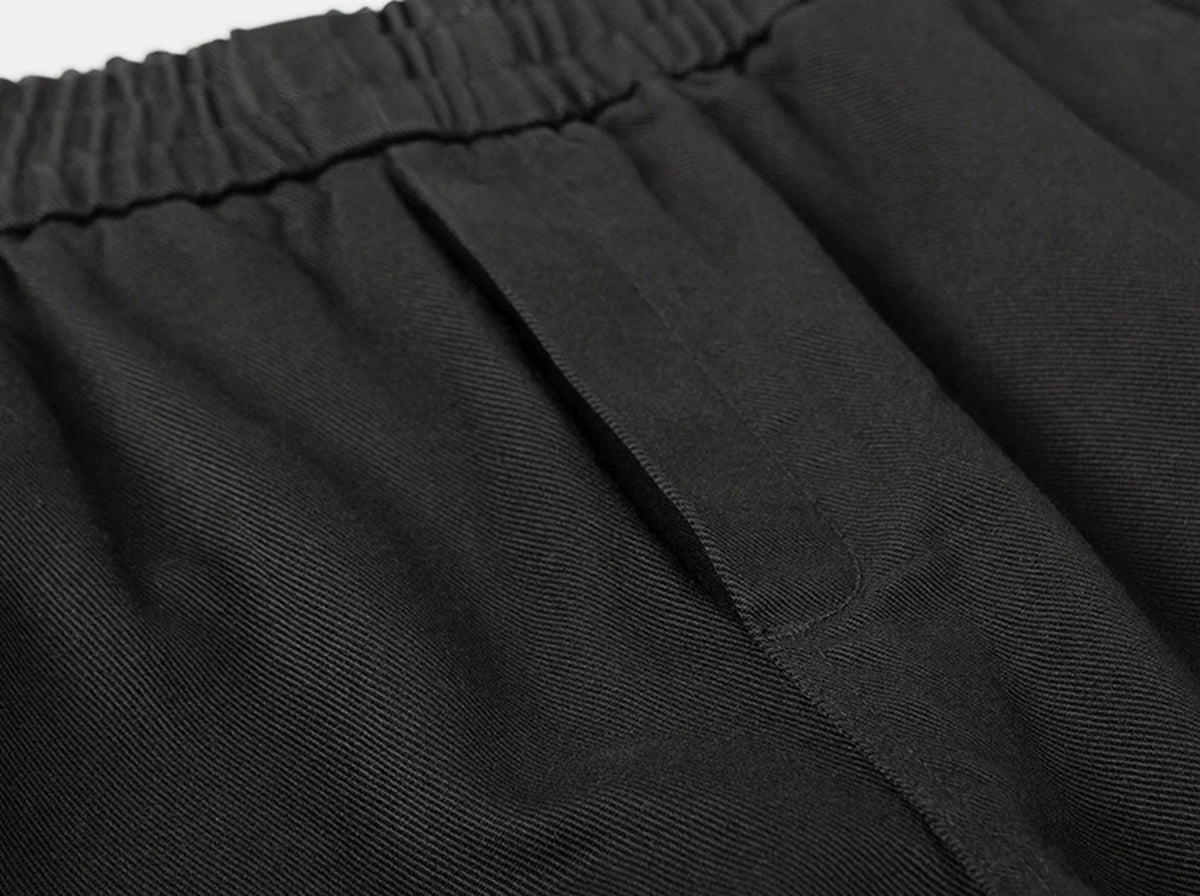 IDLT elastic waist trousers, black waistband stitching.