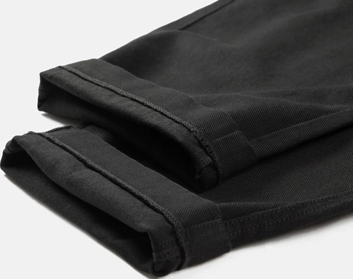 IDLT elastic waist trousers, black rolled hems.