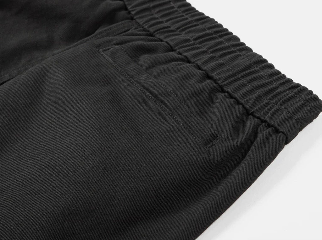 IDLT elastic waist trousers, black side pocket.