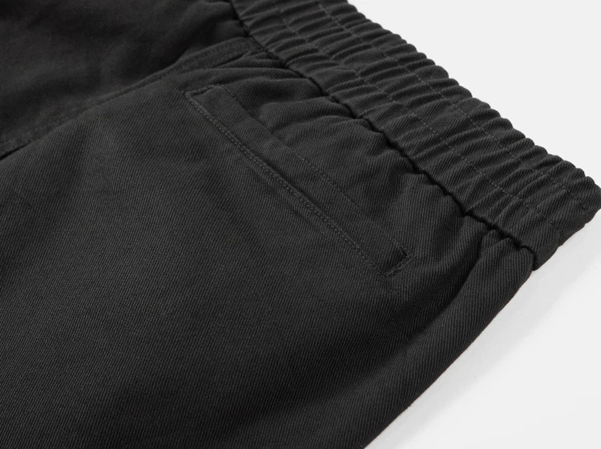 IDLT elastic waist trousers, black side pocket.