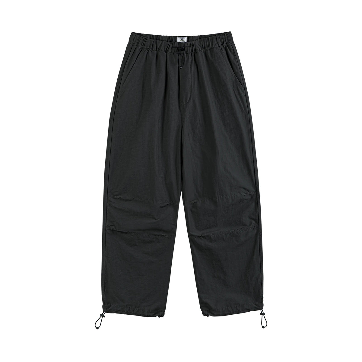 IDLT drawstring trousers, black front.