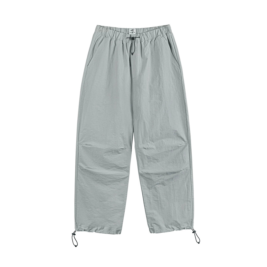 IDLT drawstring trousers, light gray front.