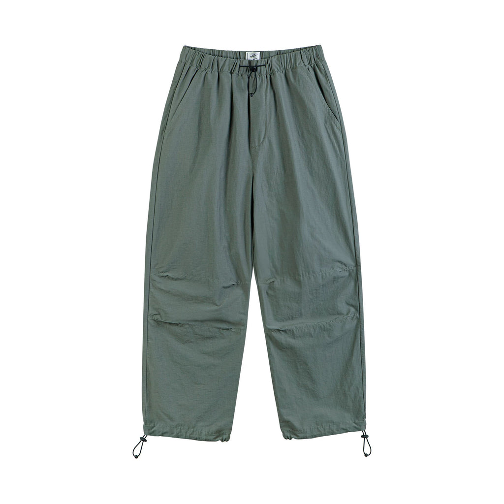 IDLT drawstring trousers, green front.