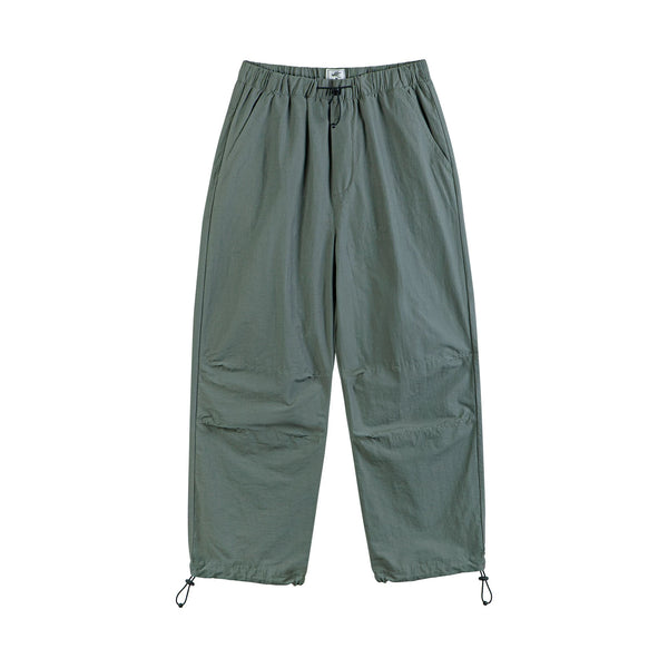IDLT drawstring trousers, green front.