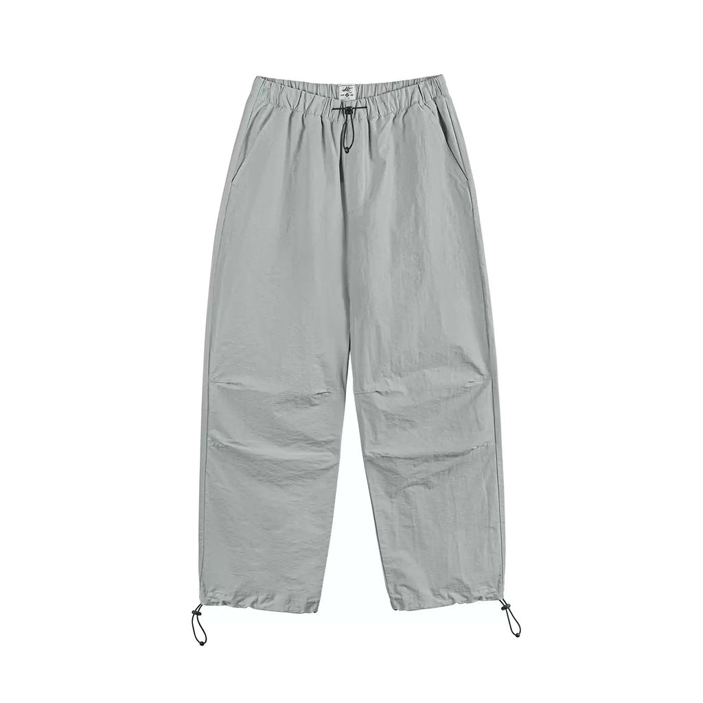 IDLT drawstring trousers, light gray front laid flat.