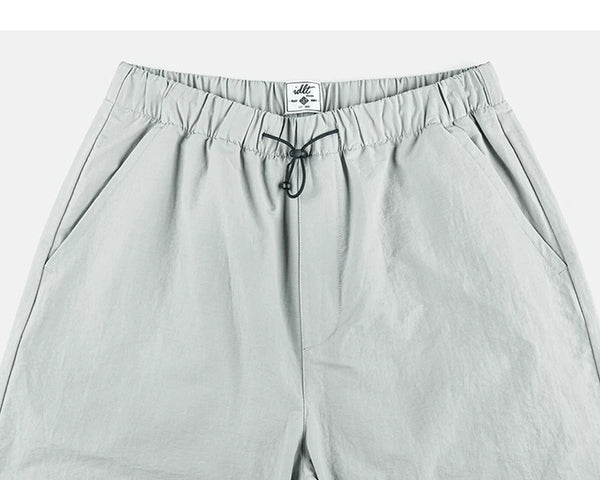 IDLT drawstring trousers, light gray waistband.