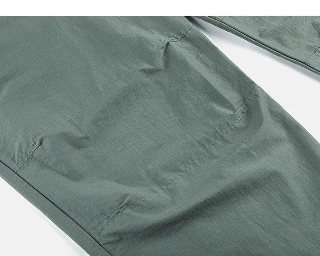 IDLT drawstring trousers, green knee seam.