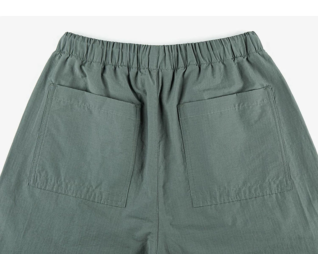 IDLT drawstring trousers, green back pockets.