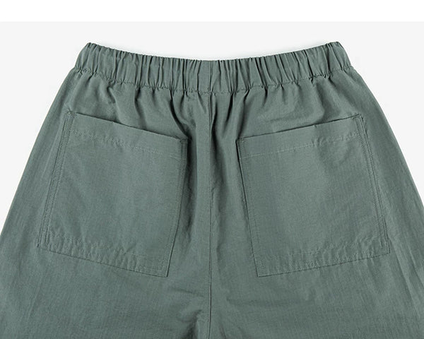 IDLT drawstring trousers, green back pockets.