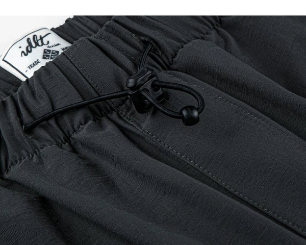IDLT drawstring trousers, black waist drawcord.