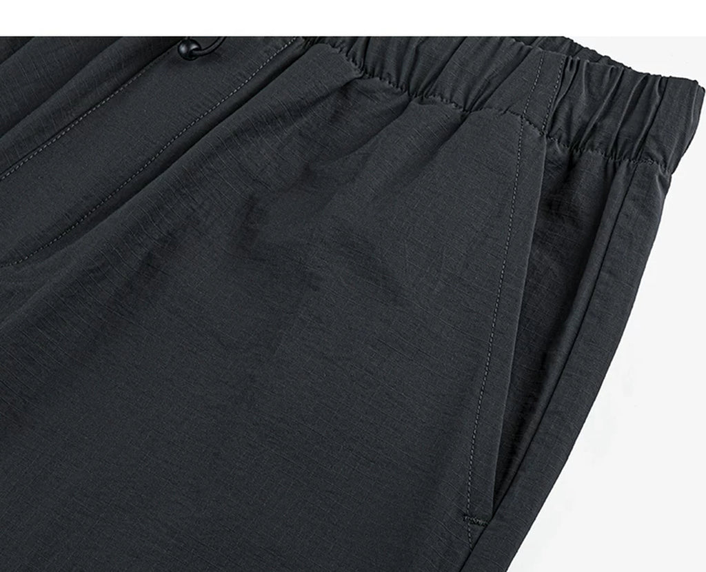 IDLT drawstring trousers, black side pocket.