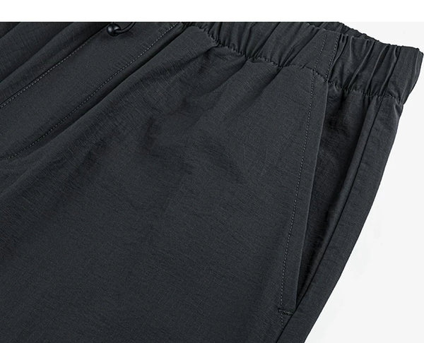 IDLT drawstring trousers, black side pocket.