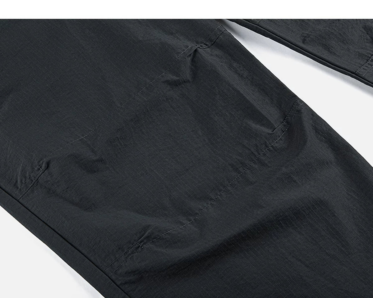 IDLT drawstring trousers, black knee seam.