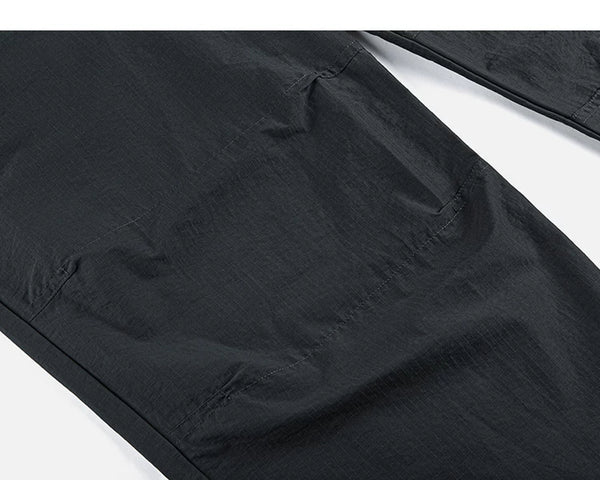 IDLT drawstring trousers, black knee seam.