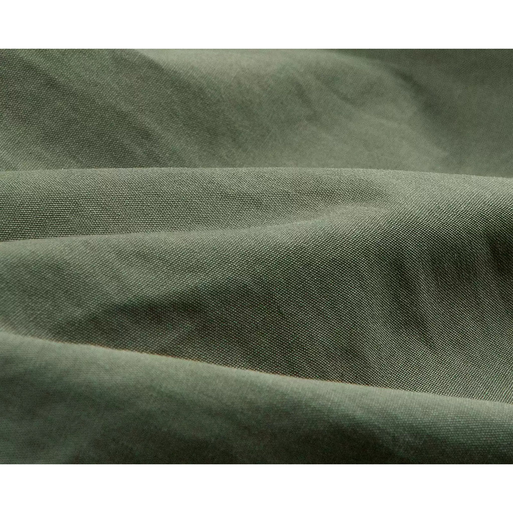 IDLT cargo pants, green fabric folds.